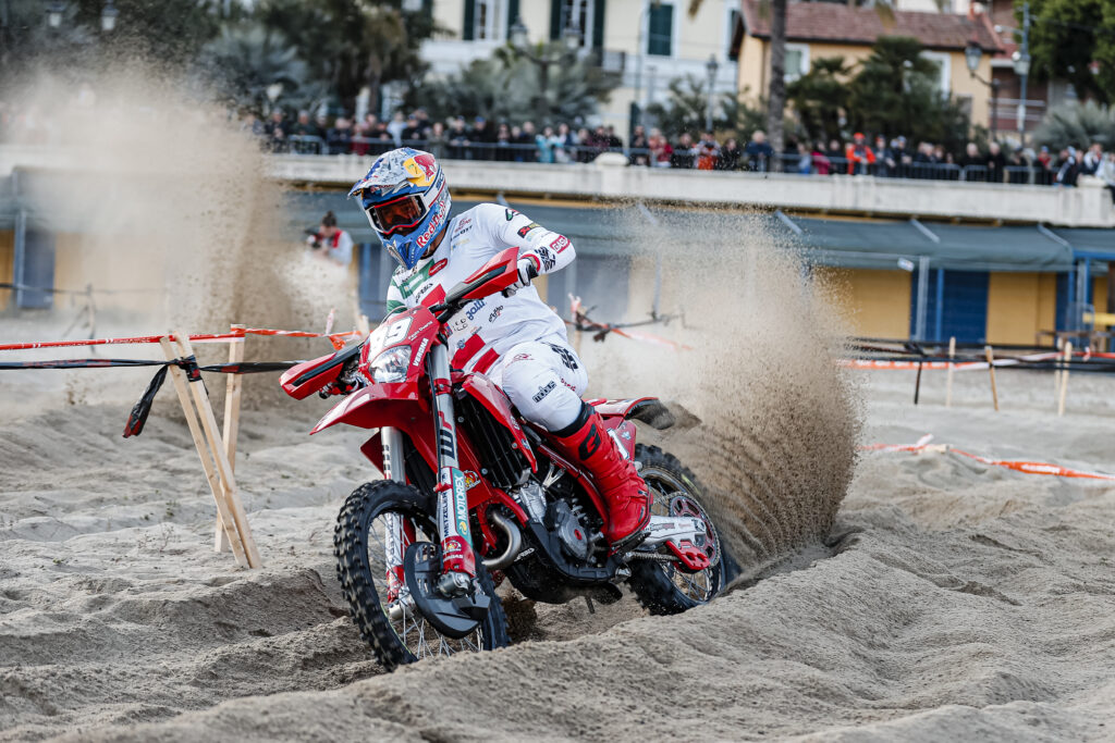 Andrea Verona riding his enduro bike through sand at an Enduro GP event